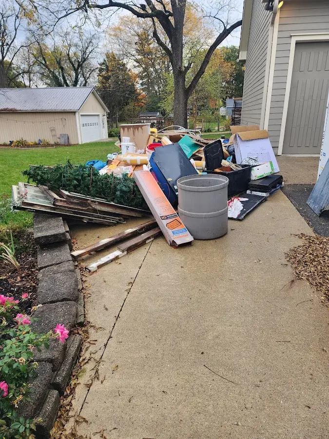 Dumpster being loaded with debris for Residential Dumpster Rental in Holyoke